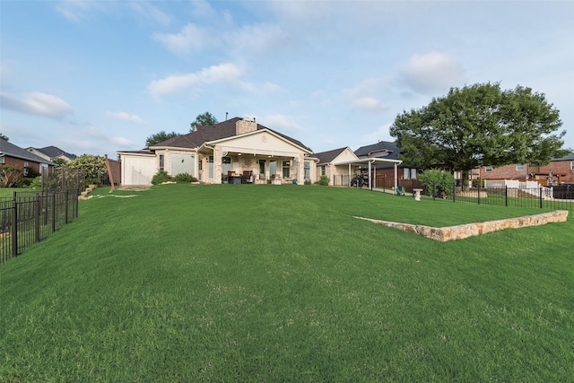 exterior space featuring a fenced backyard and a front yard