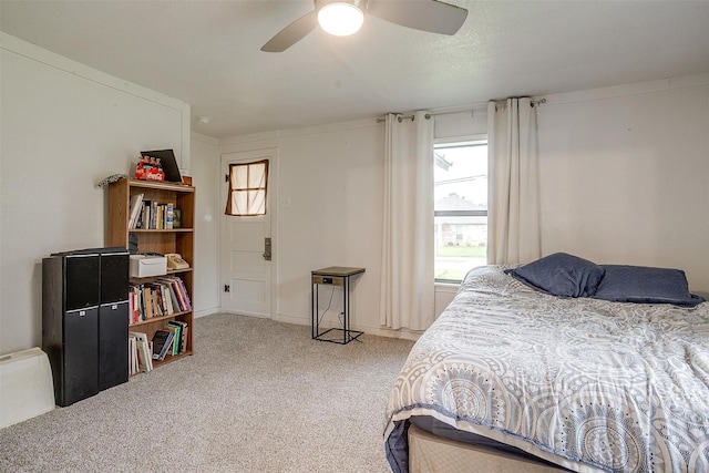 carpeted bedroom with a ceiling fan