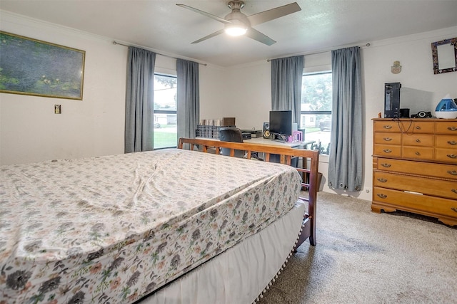 bedroom with carpet floors and a ceiling fan