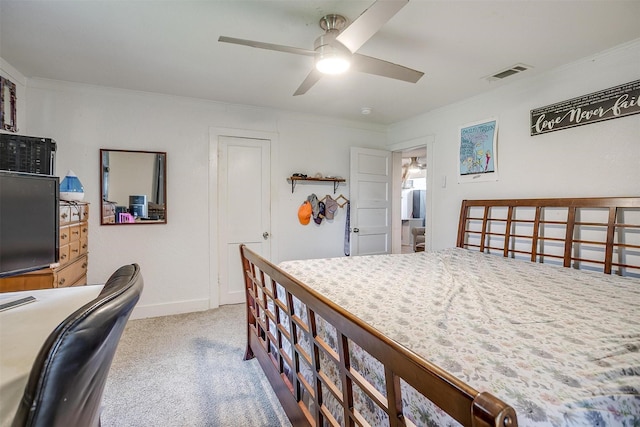 interior space featuring visible vents, ornamental molding, carpet flooring, baseboards, and a ceiling fan
