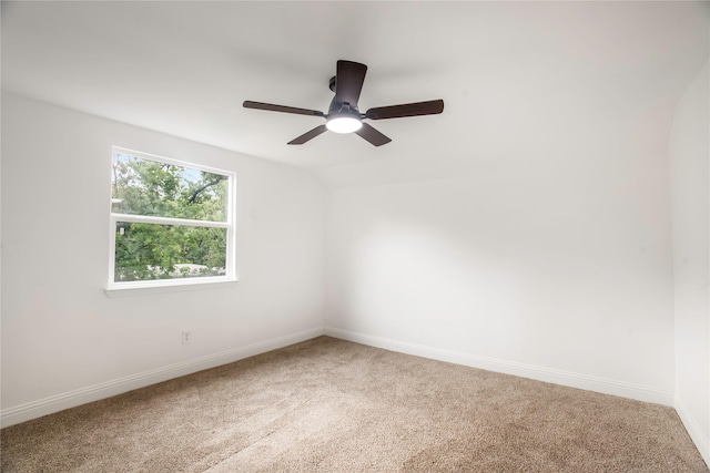 unfurnished room with baseboards, carpet flooring, and ceiling fan
