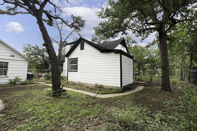 view of home's exterior with fence