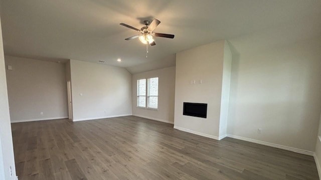 4189 Plateau Dr, Forney, TX 75126 - unfurnished living room featuring ceiling fan, wood finished floors, baseboards, a fireplace, and vaulted ceiling