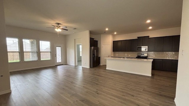 4189 Plateau Dr, Forney, TX 75126 - kitchen featuring appliances with stainless steel finishes, open floor plan, a ceiling fan, and recessed lighting