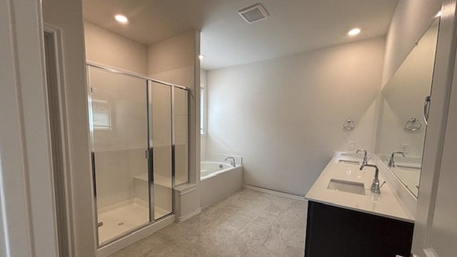 4189 Plateau Dr, Forney, TX 75126 - bathroom with a garden tub, a shower stall, double vanity, and recessed lighting