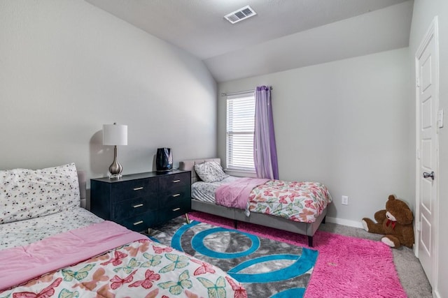 bedroom featuring visible vents, baseboards, carpet floors, and lofted ceiling