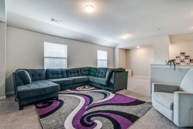 living room featuring visible vents, carpet flooring, and baseboards