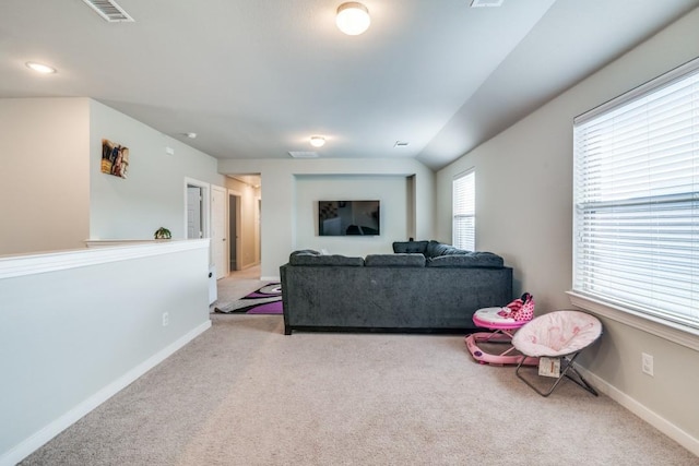 living room with visible vents, carpet flooring, and baseboards