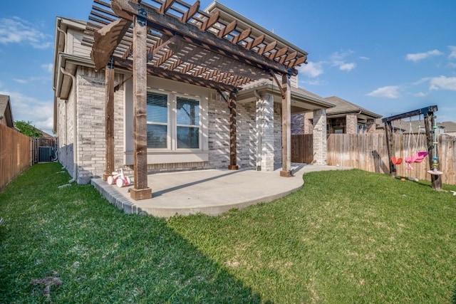 rear view of property featuring a patio area, brick siding, a fenced backyard, a yard, and a pergola