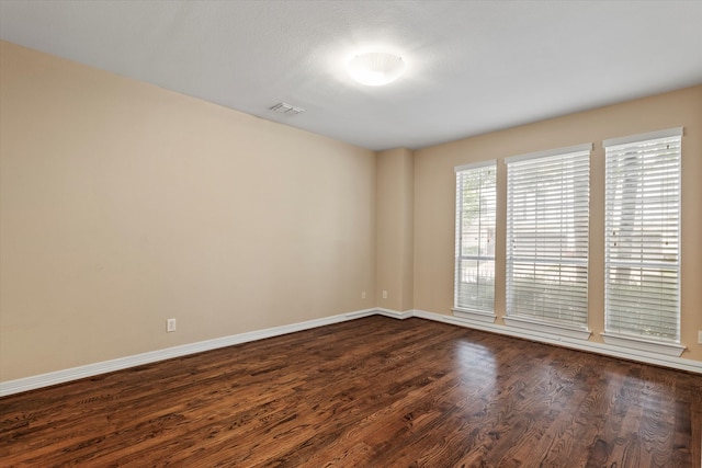 3238 Throckmorton St, Dallas, TX 75219 - empty room with dark wood-style floors and baseboards