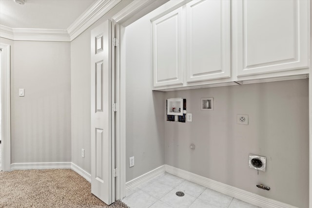 clothes washing area featuring cabinet space, washer hookup, hookup for a gas dryer, electric dryer hookup, and ornamental molding