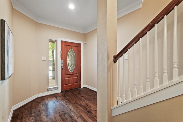 entrance foyer with dark wood-type flooring, baseboards, and crown molding