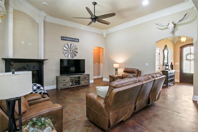 363 Leigh Ln, Stonewall, LA 71078 - living room with arched walkways, a ceiling fan, ornamental molding, baseboards, and concrete flooring