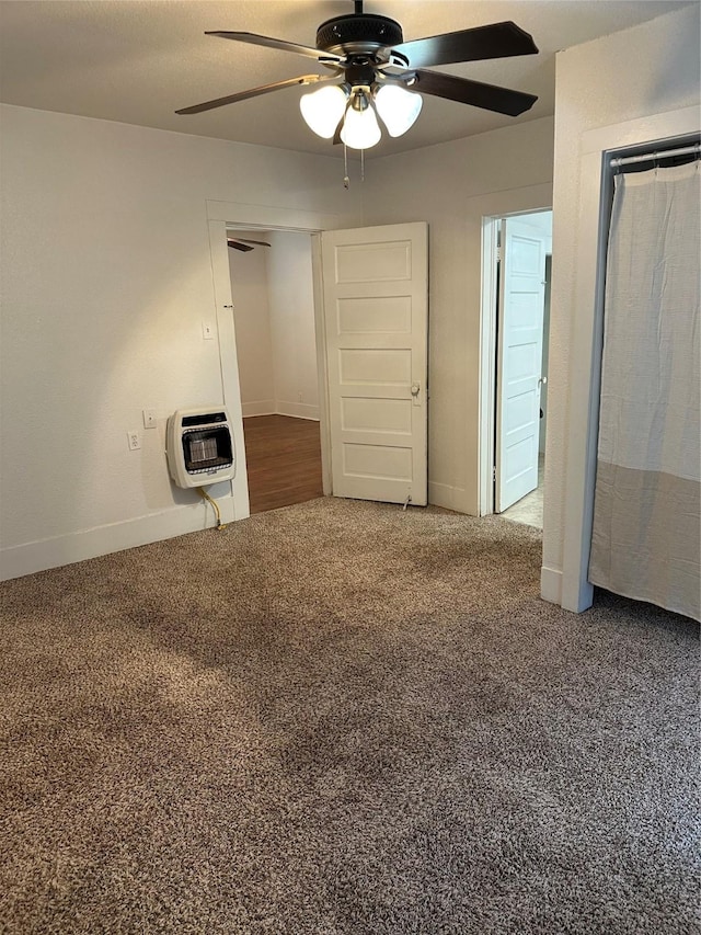 630 W College St, Stephenville, TX 76401 - unfurnished bedroom with heating unit, carpet, baseboards, and ceiling fan