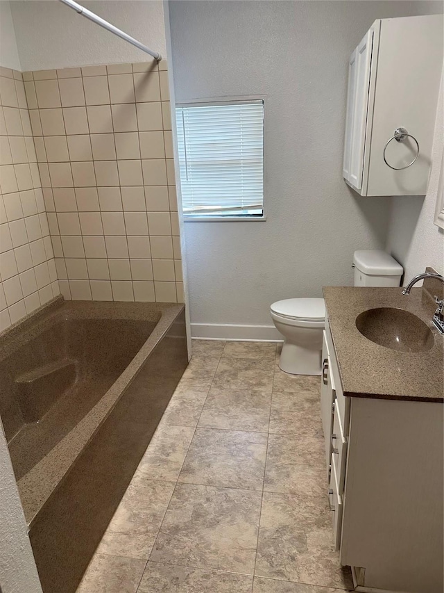 630 W College St, Stephenville, TX 76401 - bathroom featuring toilet, vanity, shower / bath combination, and baseboards