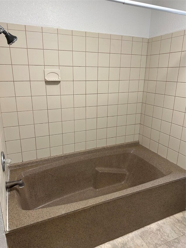 630 W College St, Stephenville, TX 76401 - bathroom featuring shower / tub combination