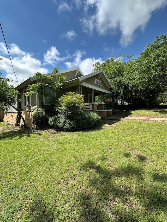 630 W College St, Stephenville, TX 76401 - view of side of property with a lawn