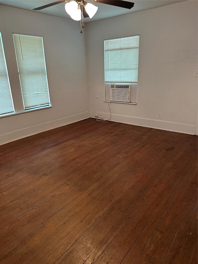 630 W College St, Stephenville, TX 76401 - spare room featuring cooling unit, ceiling fan, baseboards, and dark wood-style flooring