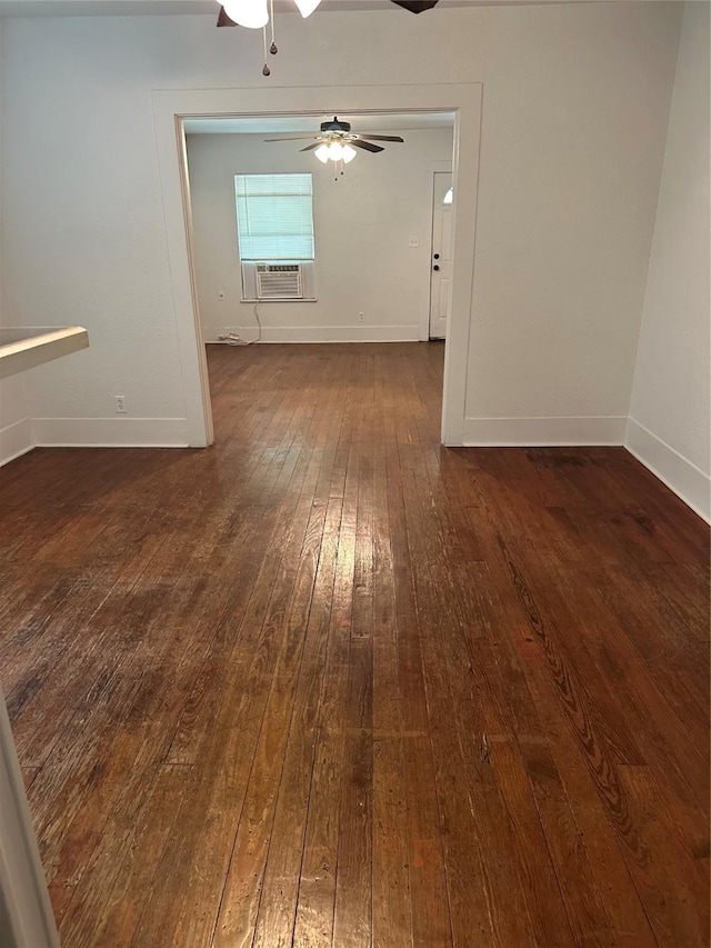 630 W College St, Stephenville, TX 76401 - empty room featuring dark wood-style flooring, a ceiling fan, baseboards, and cooling unit