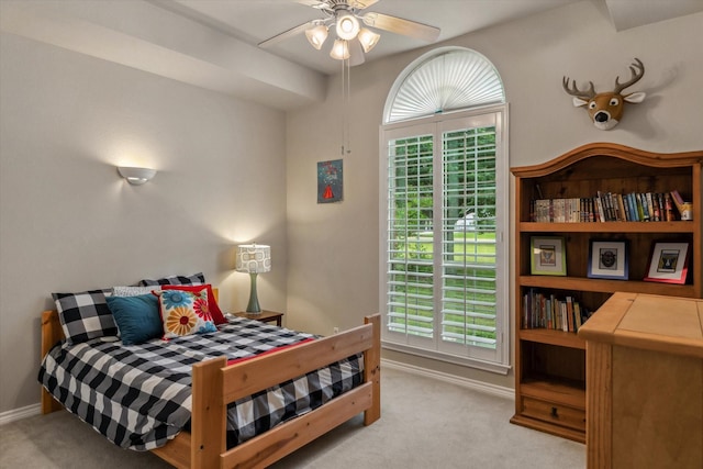 bedroom featuring carpet floors and baseboards