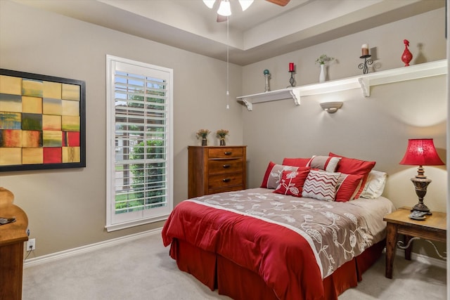 carpeted bedroom with baseboards and ceiling fan