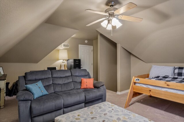 bedroom with light colored carpet, baseboards, lofted ceiling, and visible vents