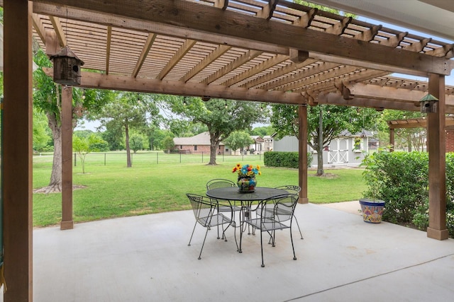 view of patio / terrace featuring an outdoor structure, a pergola, fence, and outdoor dining space