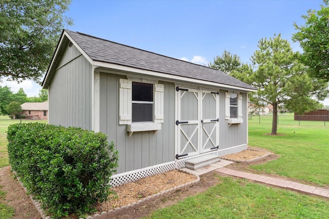 view of shed with fence