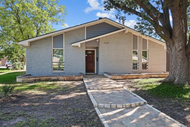 4006 Mayflower Dr, Garland, TX 75043 - mid-century home featuring brick siding