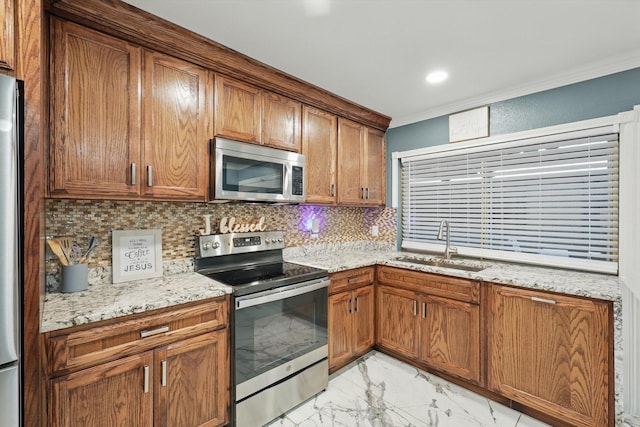 4006 Mayflower Dr, Garland, TX 75043 - kitchen featuring appliances with stainless steel finishes, light marble finish flooring, a sink, brown cabinetry, and crown molding