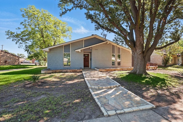 4006 Mayflower Dr, Garland, TX 75043 - mid-century inspired home featuring brick siding