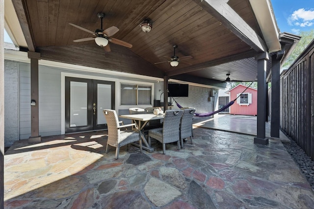 4006 Mayflower Dr, Garland, TX 75043 - view of patio featuring a storage shed, french doors, outdoor dining area, an outdoor structure, and ceiling fan