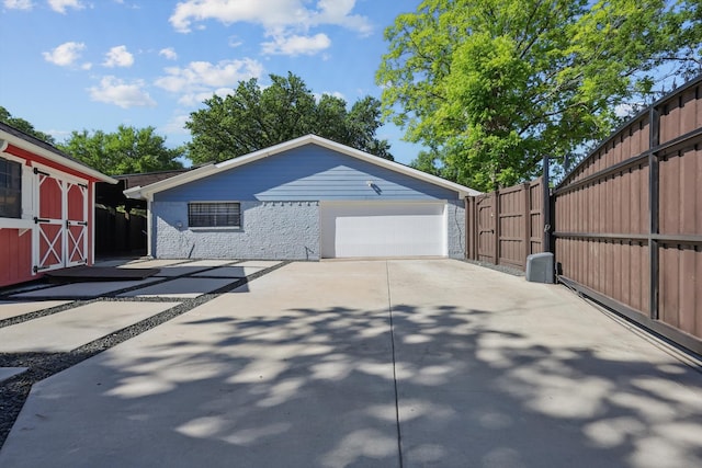 4006 Mayflower Dr, Garland, TX 75043 - view of side of property with fence, an outdoor structure, and a storage unit