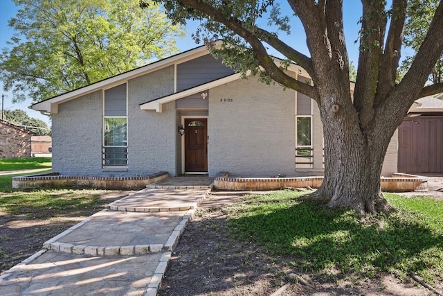 4006 Mayflower Dr, Garland, TX 75043 - mid-century modern home with brick siding