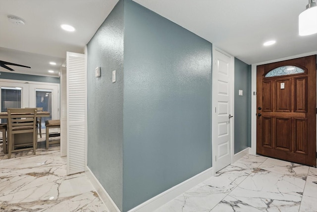 4006 Mayflower Dr, Garland, TX 75043 - entryway with baseboards, light marble finish floors, a textured wall, a ceiling fan, and recessed lighting