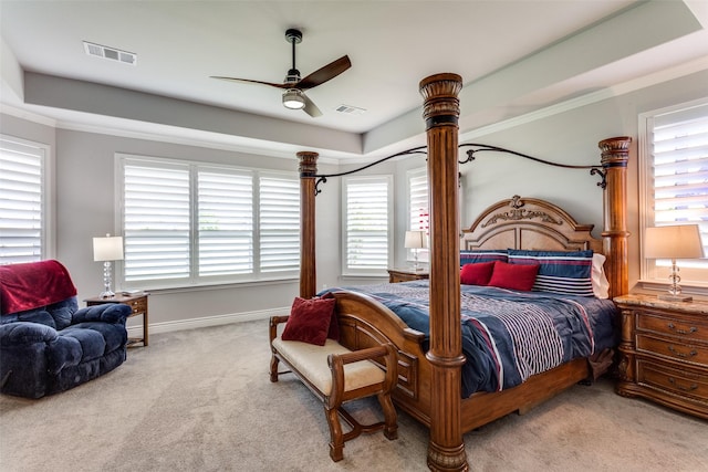 carpeted bedroom with baseboards, ceiling fan, and visible vents