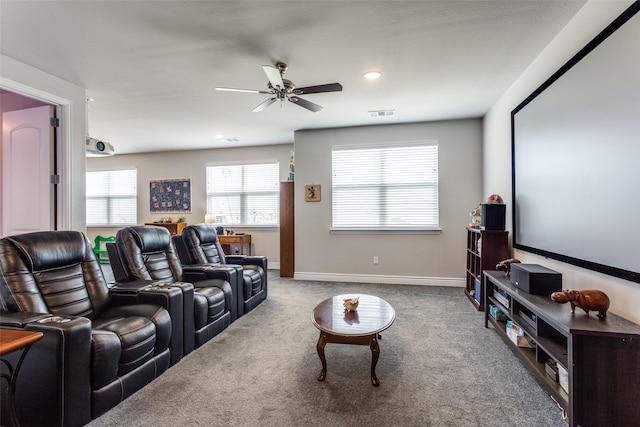 carpeted cinema room with a ceiling fan, baseboards, visible vents, and recessed lighting
