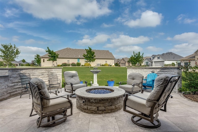 view of patio / terrace featuring a residential view and a fire pit