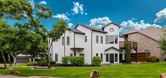 2856 Peninsula Dr, Grapevine, TX 76051 - back of house featuring a lawn, stucco siding, and fence
