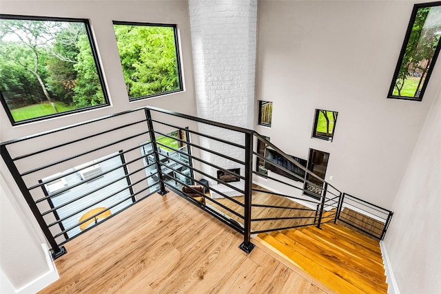 2856 Peninsula Dr, Grapevine, TX 76051 - staircase with baseboards, a wealth of natural light, and wood finished floors