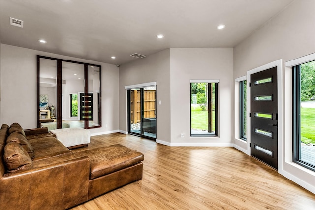 2856 Peninsula Dr, Grapevine, TX 76051 - living room featuring baseboards, recessed lighting, light wood-style flooring, and visible vents