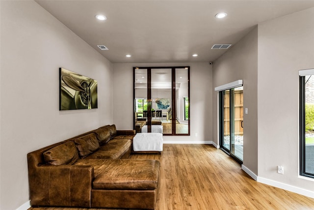 2856 Peninsula Dr, Grapevine, TX 76051 - living room featuring visible vents, recessed lighting, and light wood-style floors