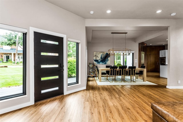 2856 Peninsula Dr, Grapevine, TX 76051 - foyer entrance with plenty of natural light, light wood finished floors, and baseboards