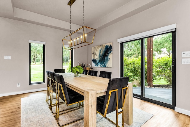 2856 Peninsula Dr, Grapevine, TX 76051 - dining room featuring baseboards, a chandelier, and light wood finished floors