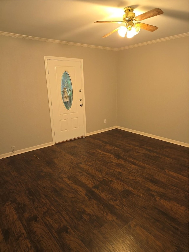 foyer entrance featuring crown molding, a ceiling fan, dark wood finished floors, and baseboards