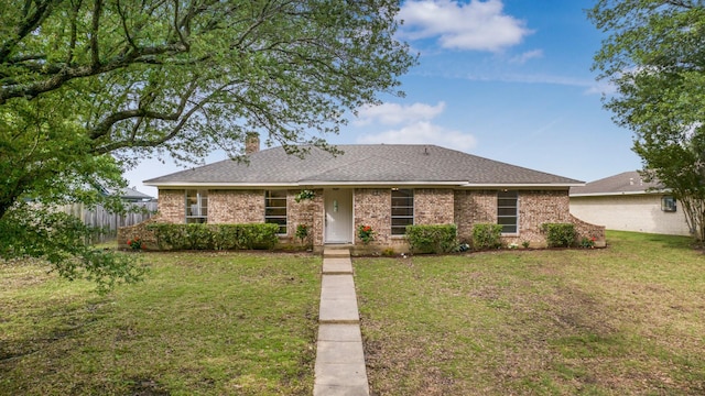1004 Meridith Dr, Terrell, TX 75160 - rear view of property featuring a yard, brick siding, fence, and a chimney
