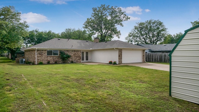 1004 Meridith Dr, Terrell, TX 75160 - rear view of house featuring driveway, french doors, a garage, central air condition unit, and fence