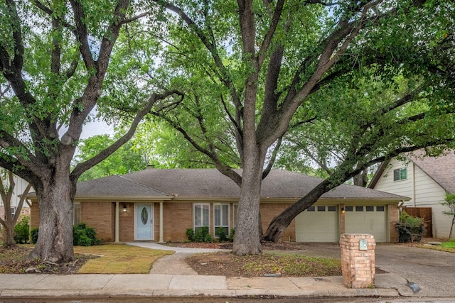 2103 Juanita Dr, Arlington, TX 76013 - ranch-style home with an attached garage, a shingled roof, driveway, and brick siding