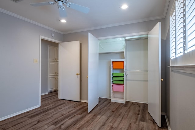 2103 Juanita Dr, Arlington, TX 76013 - unfurnished bedroom featuring multiple windows, wood finished floors, and a closet