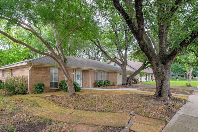 2103 Juanita Dr, Arlington, TX 76013 - ranch-style house featuring roof with shingles, an attached garage, and brick siding